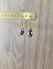 18K gold plated earrings with Black Silver Night Swarovski crystal drops on jewellery display