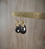 18K gold plated dragonfly earrings with "Black Silver Night" Swarovski crystal drops on display.