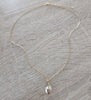 Medium length 18K gold plated necklace with Golden Shadow Swarovski crystal drop.