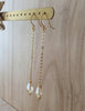 18K gold plated Long-length dangle earrings handmade with Golden Shadow Swarovski crystals on display