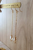 18K gold plated Long-length dangle earrings with Golden Shadow Swarovski crystals on jewellery display