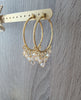 18K gold plated hoop earrings with Golden Shadow Swarovski crystals on jewellery display