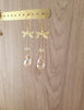 18K gold plated dragonfly earrings with Golden Shadow Swarovski drops on display