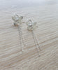 Rhodium plated butterfly dangle earrings featuring clear Swarovski crystal charms