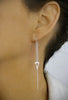 Woman wearing stylish platinum plated chain threader earrings with Zirconia