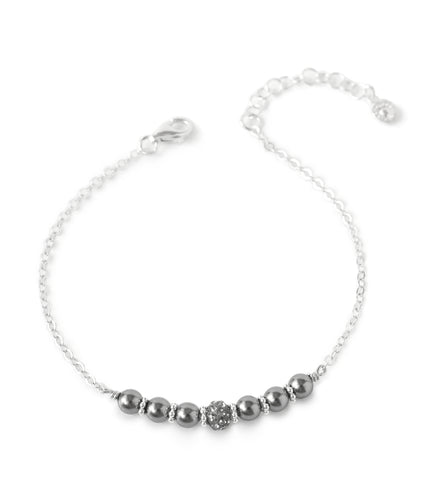 Silver bracelet adorned with dark grey Swarovski pearls and pavé crystal ball.