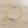18K gold plated butterfly bracelet adorned with sparkling Tanzanite Swarovski crystals.
