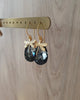 18K gold plated dragonfly earrings with "Black Silver Night" Swarovski crystal drops on display.