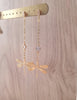 18K gold plated dragonfly and diamond-cut crystal stud earrings on display.