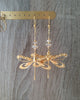 18K gold plated statement dragonfly earrings featuring Golden Shadow Swarovski crystals on display.