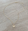 Short 18K gold plated necklace with crystal-embellished dragonfly pendant.