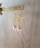 18K gold plated dragonfly earrings featuring Golden Shadow Swarovski crystal drops on display.