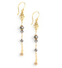 Long-length 18K gold plated flowerlink earrings decorated with Black Silver Night Swarovski crystals.