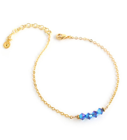 18K gold plated chain bracelet adorned with sparkling Montana AB Swarovski crystals.