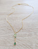 18K gold plated necklace featuring a Peridot green crystal butterfly and emerald drop.