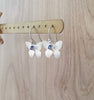 Handmade rhodium plated butterfly earrings featuring Tanzanite Swarovski crystal charms