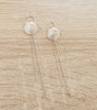 Long-length rhodium plated seashell earrings