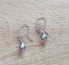 Silver flower earrings featuring Tanzanite AB Swarovski crystal drops